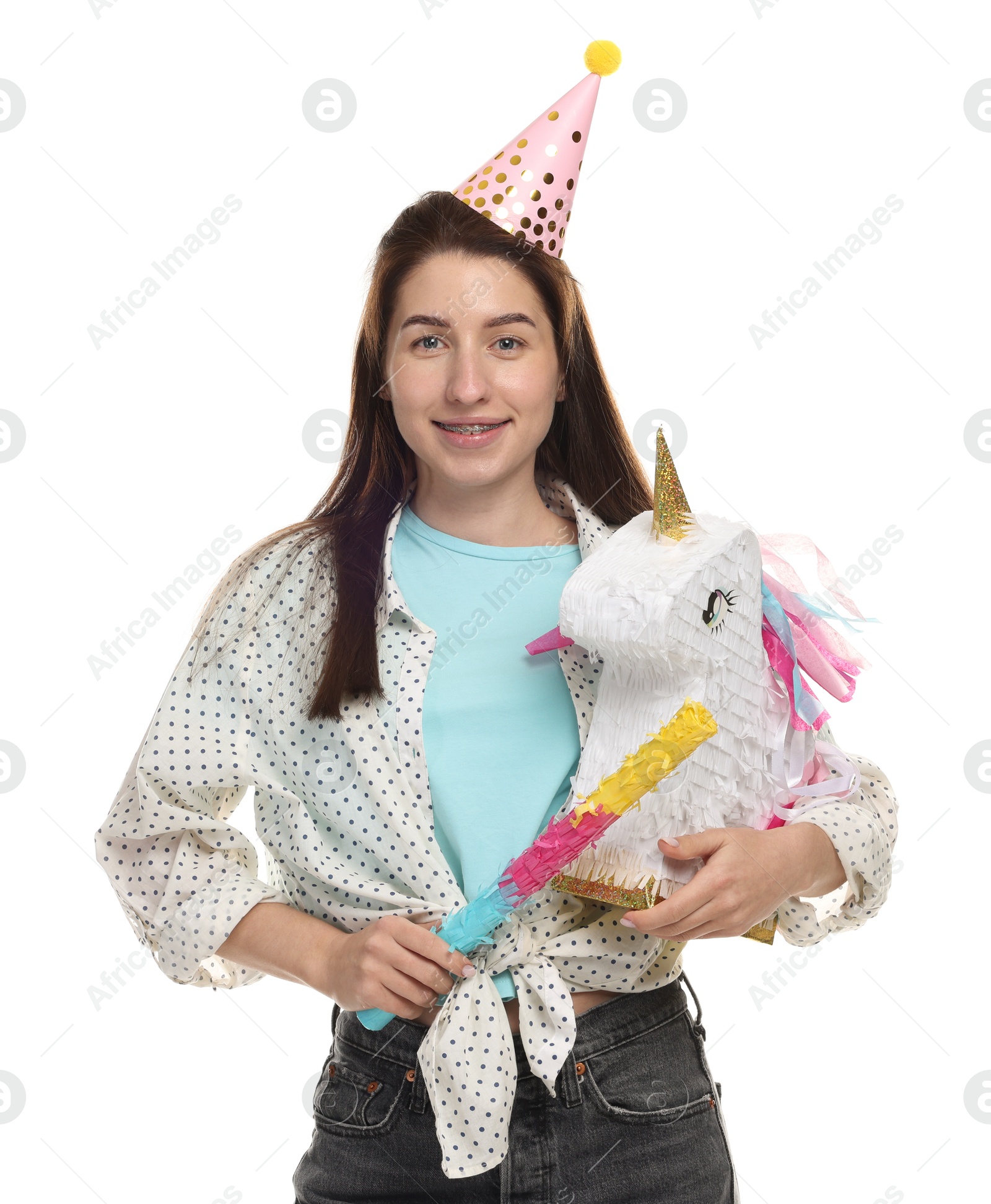 Photo of Happy woman with unicorn shaped pinata and stick on white background