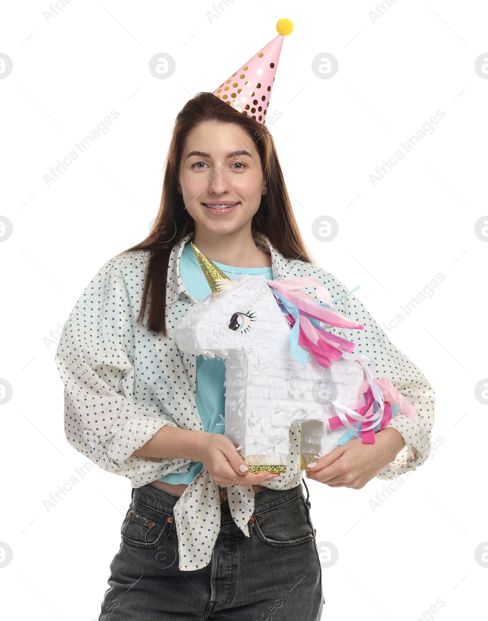 Photo of Happy woman with unicorn shaped pinata on white background