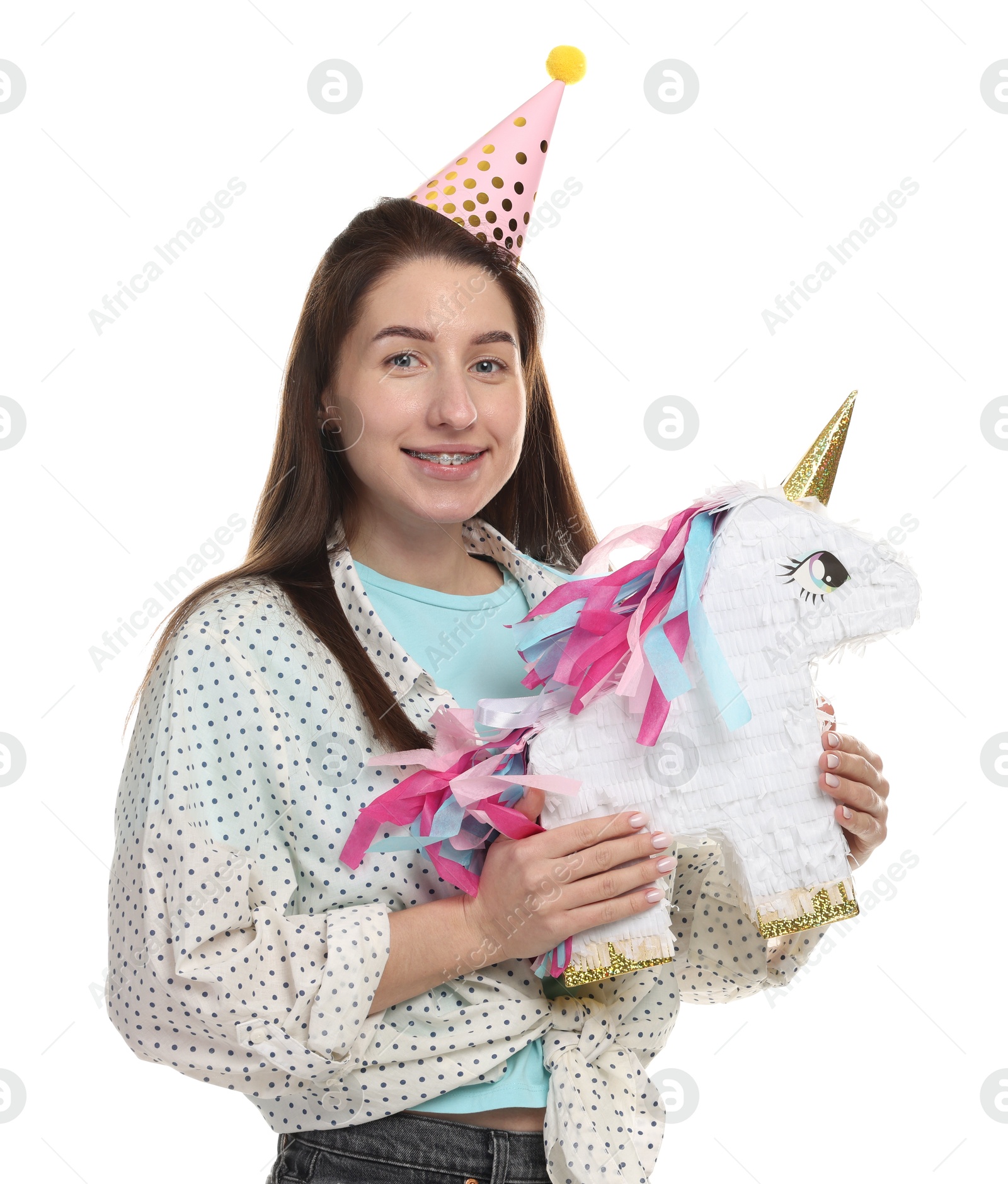 Photo of Happy woman with unicorn shaped pinata on white background