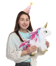 Photo of Happy woman with unicorn shaped pinata on white background