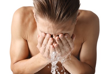 Photo of Man washing his face on white background