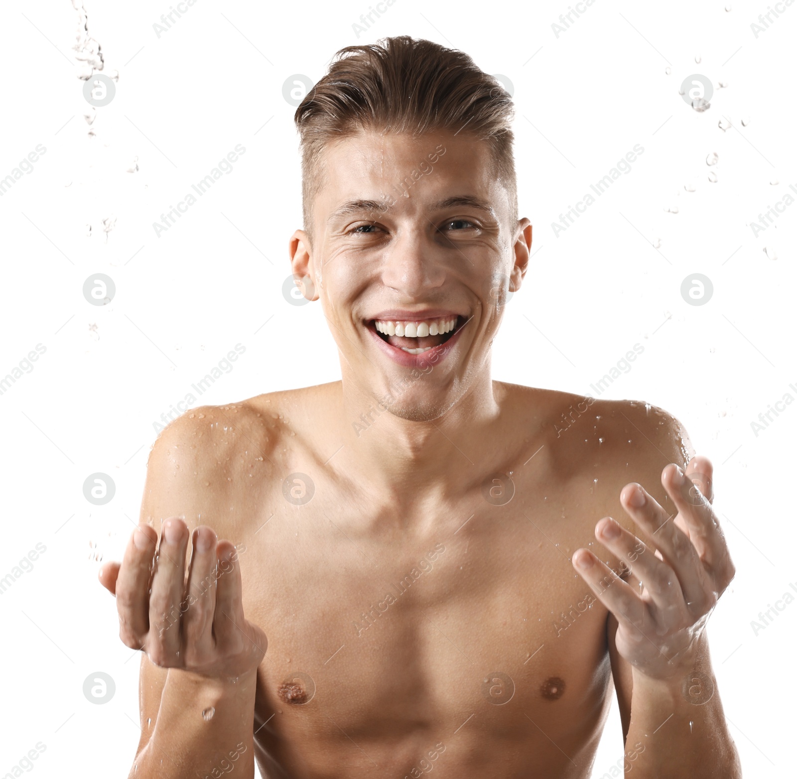 Photo of Smiling man washing his face on white background