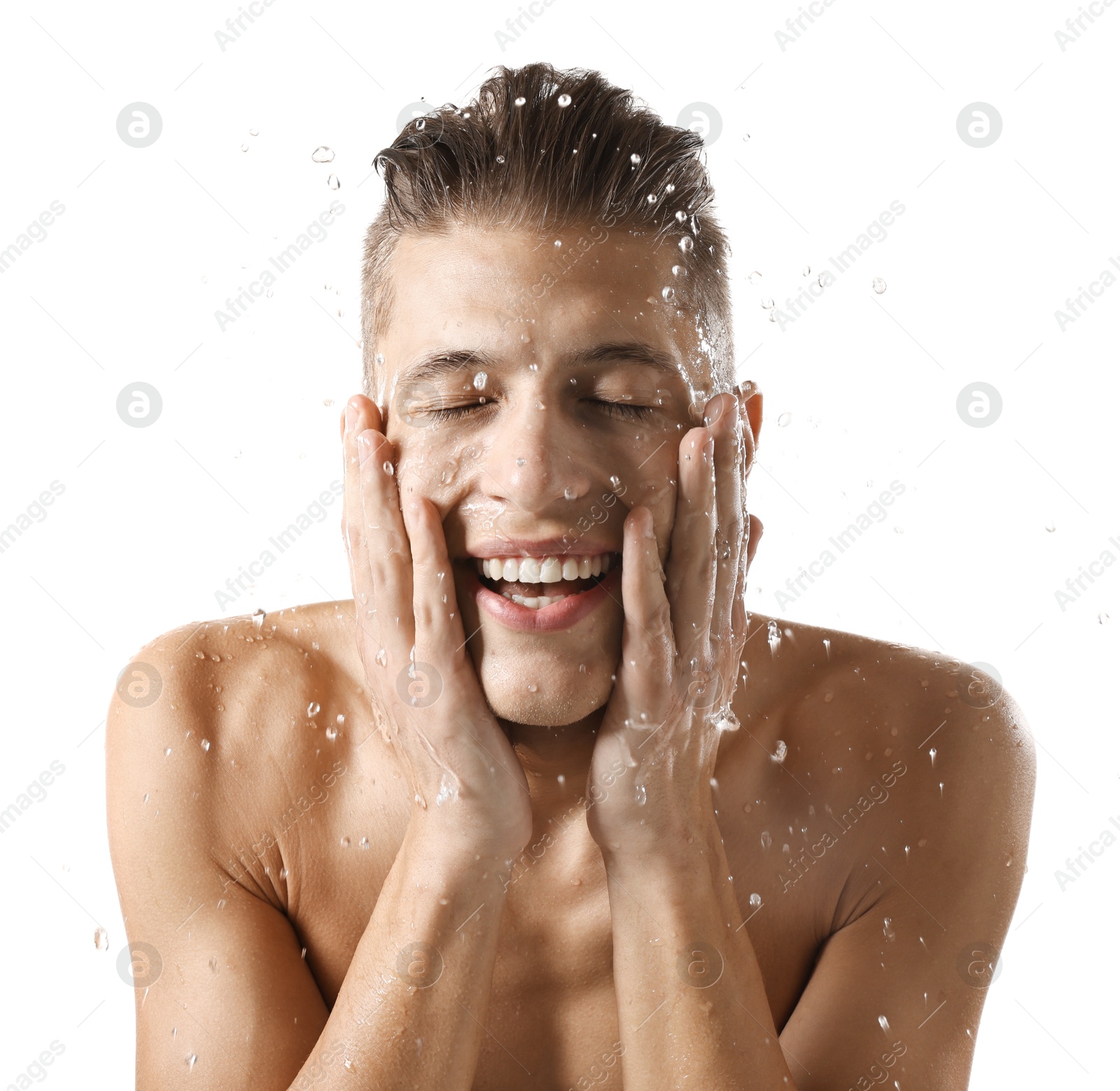 Photo of Smiling man washing his face on white background