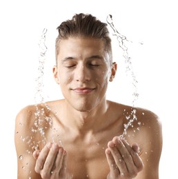 Photo of Handsome man washing his face on white background