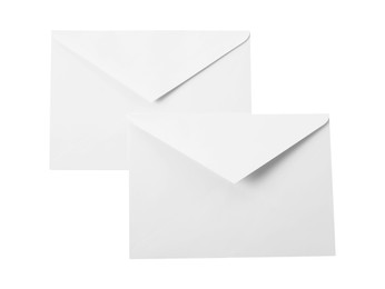 Photo of Envelopes isolated on white, top view. Mockup for design