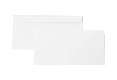 Photo of Envelopes isolated on white, top view. Mockup for design