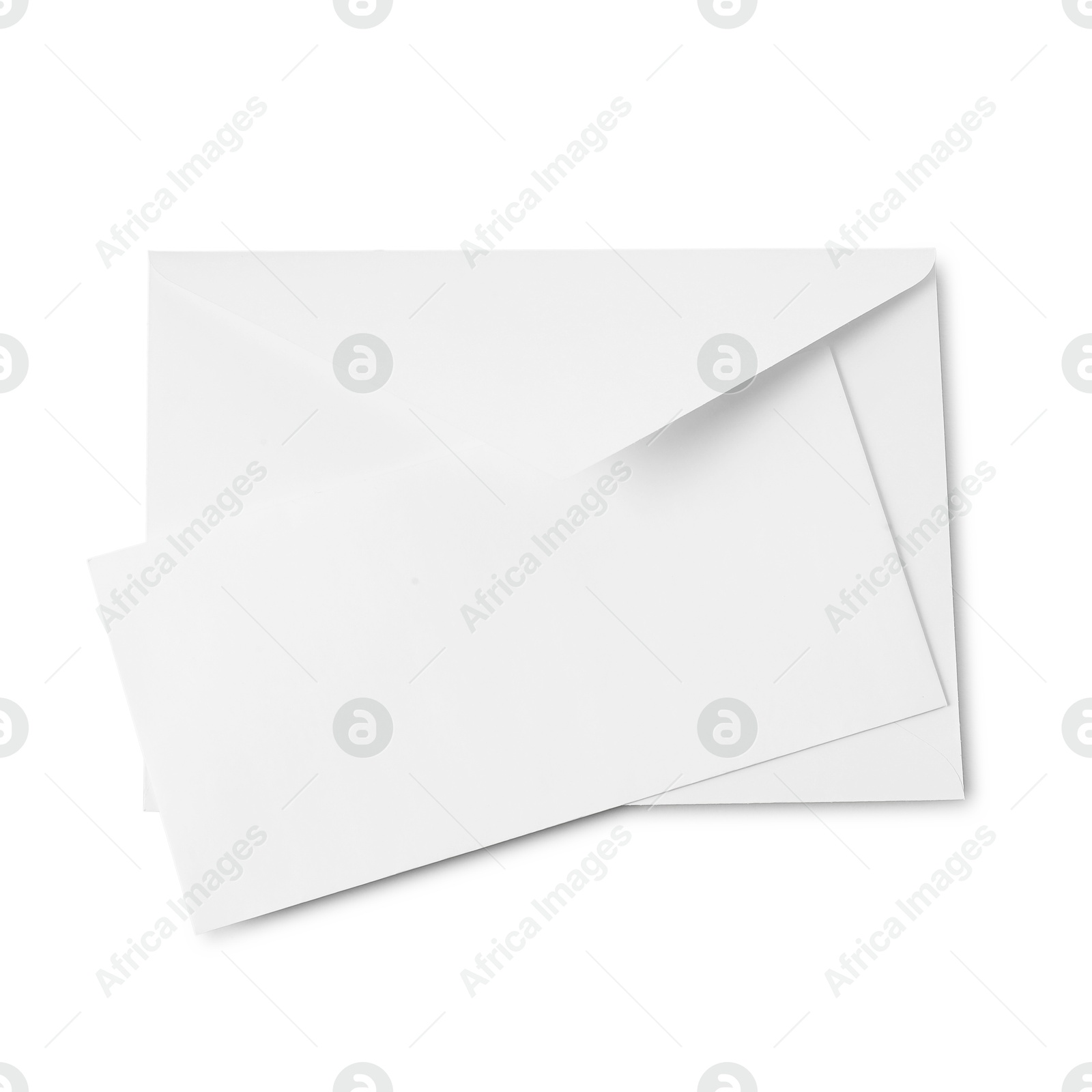 Photo of Envelope and card isolated on white, top view. Mockup for design