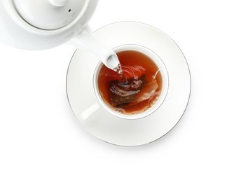 Photo of Pouring hot water into cup with tea bag on white background, top view