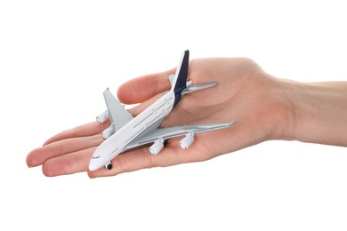 Photo of Woman with plane model on white background, closeup