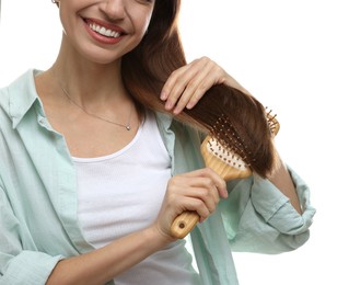 Photo of Woman brushing her hair on white background, closeup