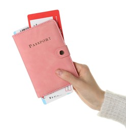 Photo of Woman holding passport with tickets on white background, closeup