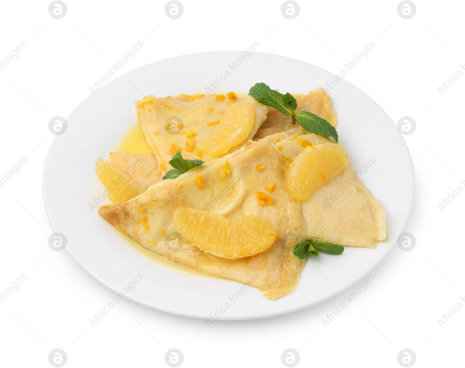 Photo of Plate with tasty crepes Suzette isolated on white