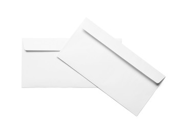 Photo of Envelopes isolated on white, top view. Mockup for design