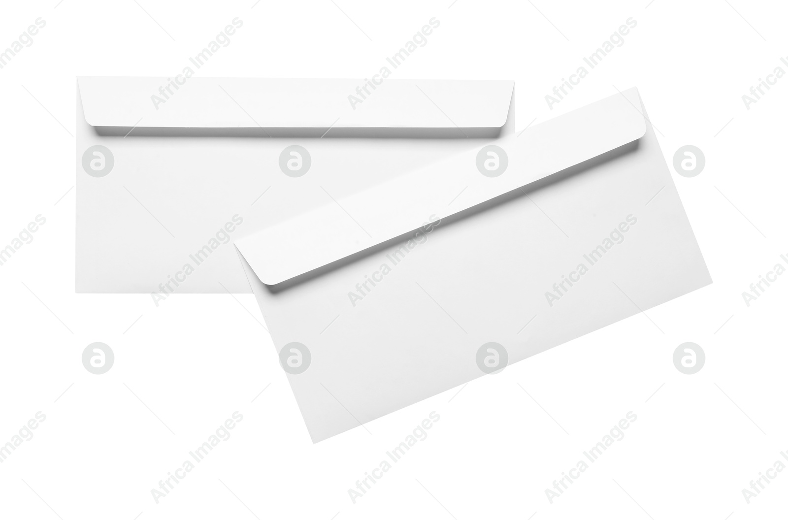 Photo of Envelopes isolated on white, top view. Mockup for design