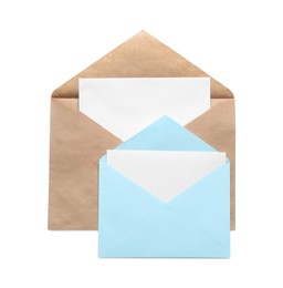 Photo of Envelopes isolated with cards on white, top view. Mockup for design