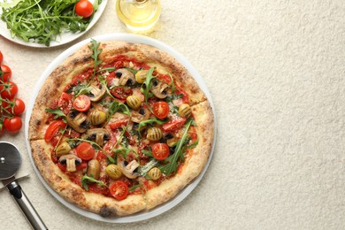 Photo of Tasty pizza with mushrooms, olives, tomatoes and arugula served on white textured table, flat lay. Space for text