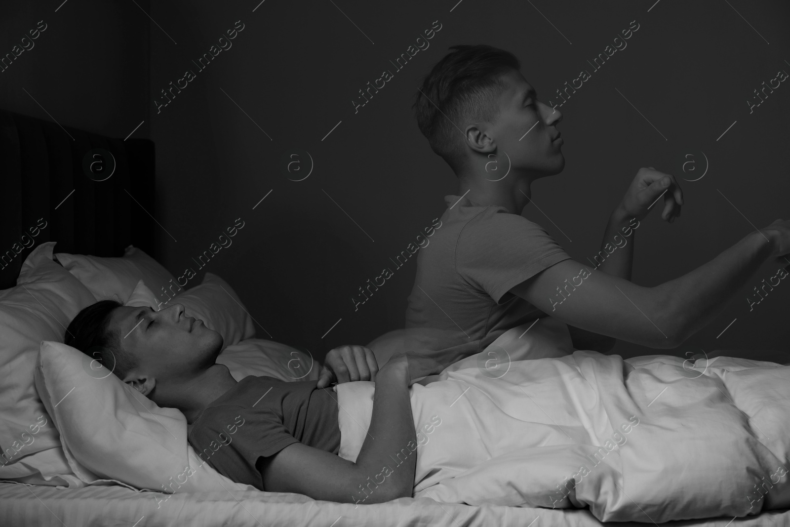 Image of Young man suffering from sleepwalking at home, double exposure. Black-and-white