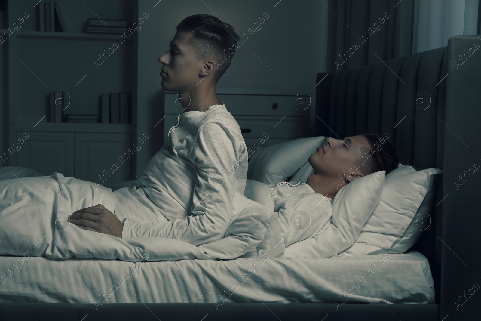 Image of Young man suffering from sleepwalking at home, double exposure