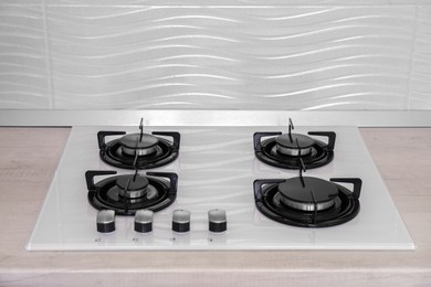 Photo of Modern gas hob in kitchen. Domestic appliance