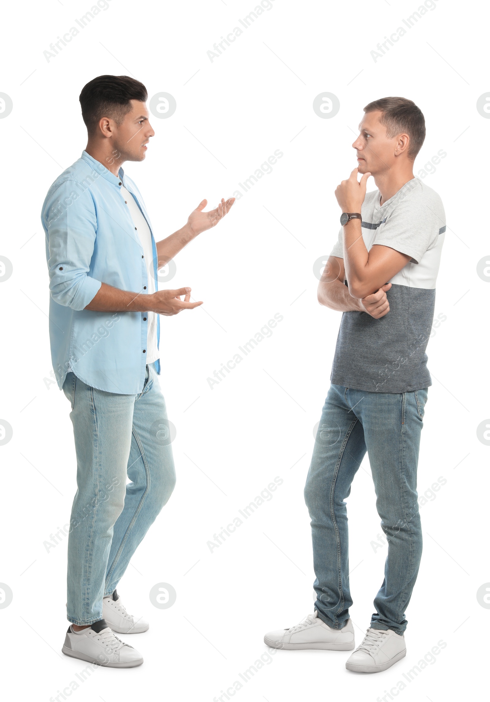 Photo of Men in casual clothes talking on white background