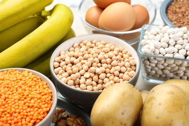 Photo of Different products rich in iron on table, closeup. Diet plan for anemia