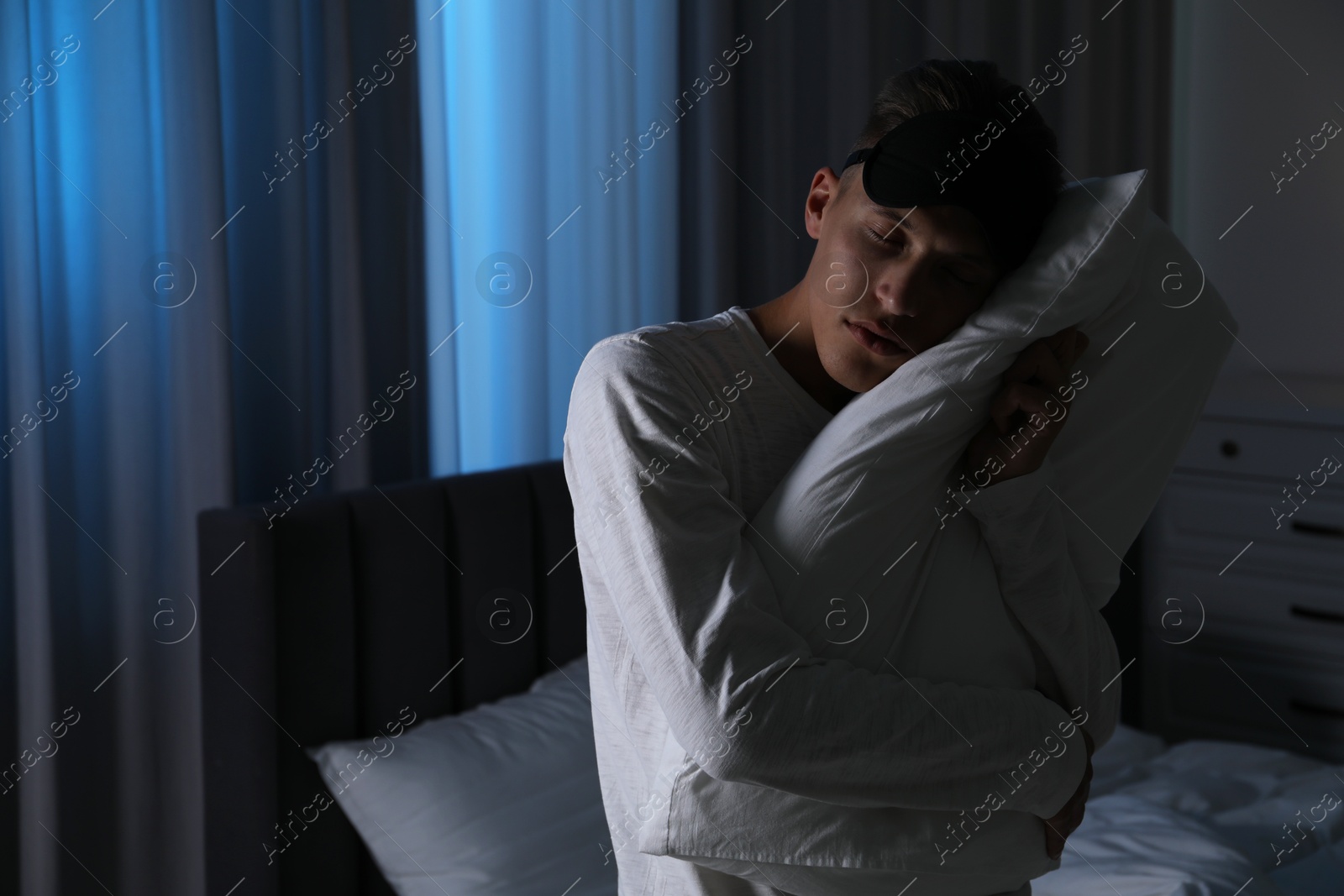 Photo of Young man suffering from sleepwalking at home