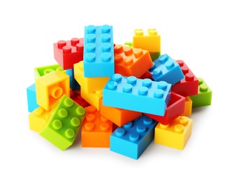 Photo of Construction toy. Pile of building bricks isolated on white