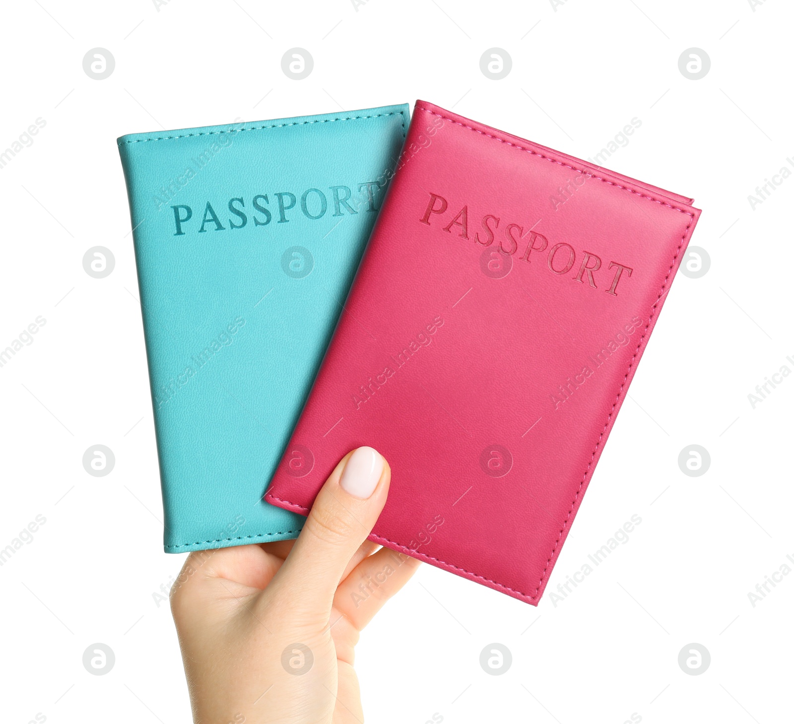 Photo of Woman holding passports in color covers on white background, closeup