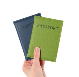 Photo of Woman holding passports in color covers on white background, closeup