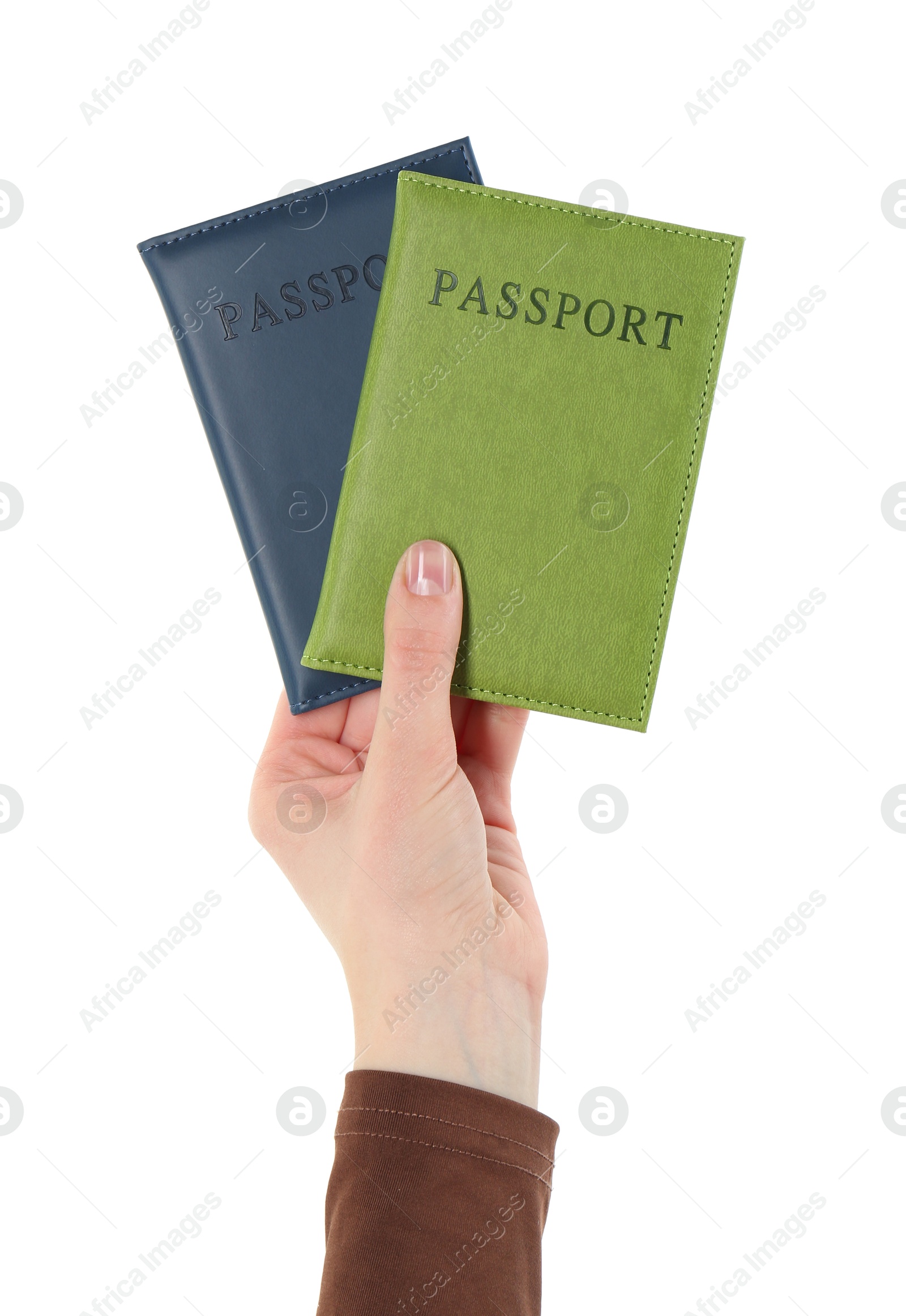 Photo of Woman holding passports in color covers on white background, closeup