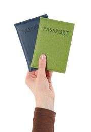 Photo of Woman holding passports in color covers on white background, closeup