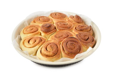 Photo of Freshly baked cinnamon rolls in baking dish isolated on white