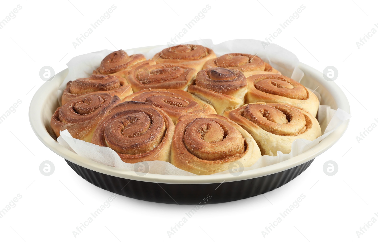 Photo of Freshly baked cinnamon rolls in baking dish isolated on white