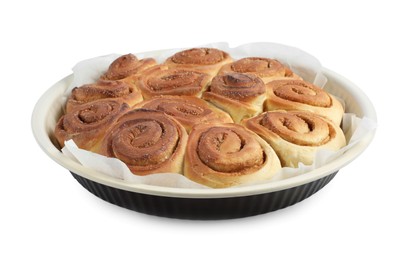 Photo of Freshly baked cinnamon rolls in baking dish isolated on white