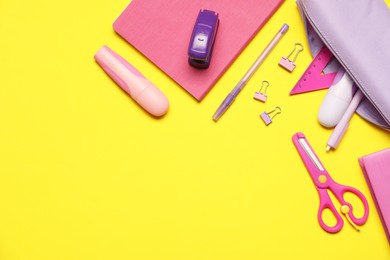 Photo of Different stationery on yellow background, flat lay. Space for text