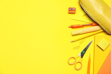 Photo of Different stationery on yellow background, flat lay. Space for text
