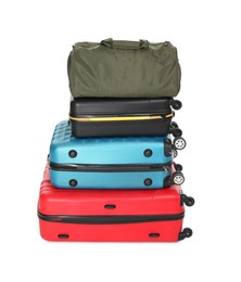 Photo of Stack of colorful suitcases and bag isolated on white