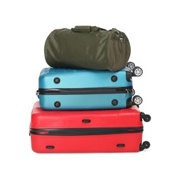 Photo of Stack of colorful suitcases and bag isolated on white