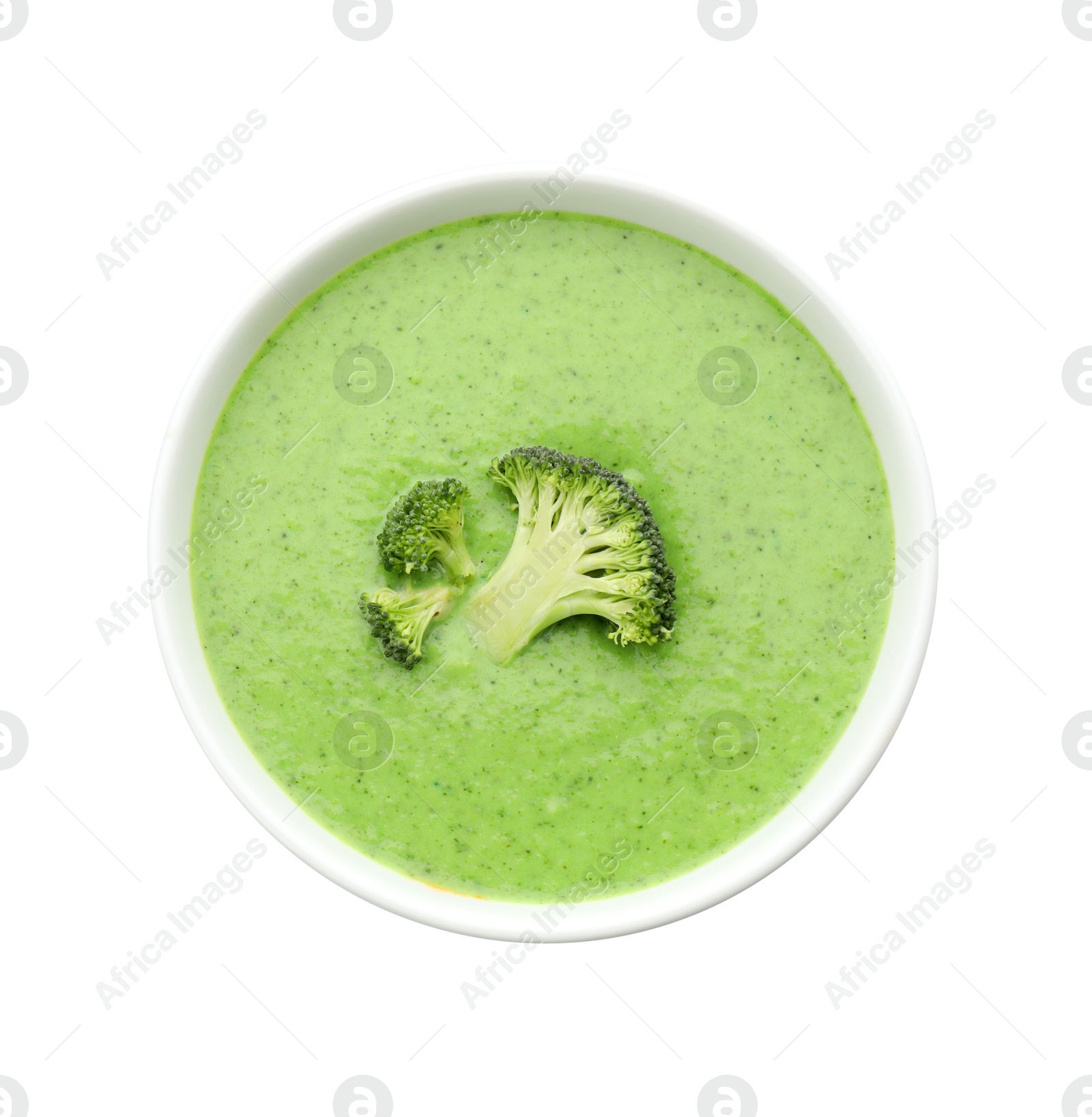 Photo of Delicious broccoli cream soup in bowl isolated on white, top view