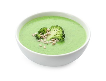 Photo of Delicious broccoli cream soup with sunflower seeds in bowl isolated on white