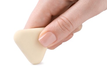 Photo of Woman using eraser on white background, closeup