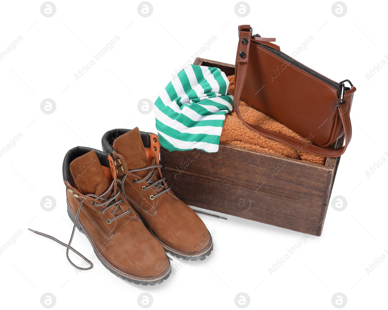 Photo of Crate with used clothes, bag and shoes isolated on white