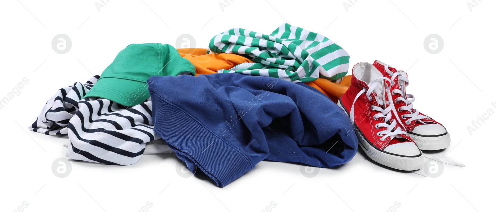 Photo of Pile of different used clothes isolated on white