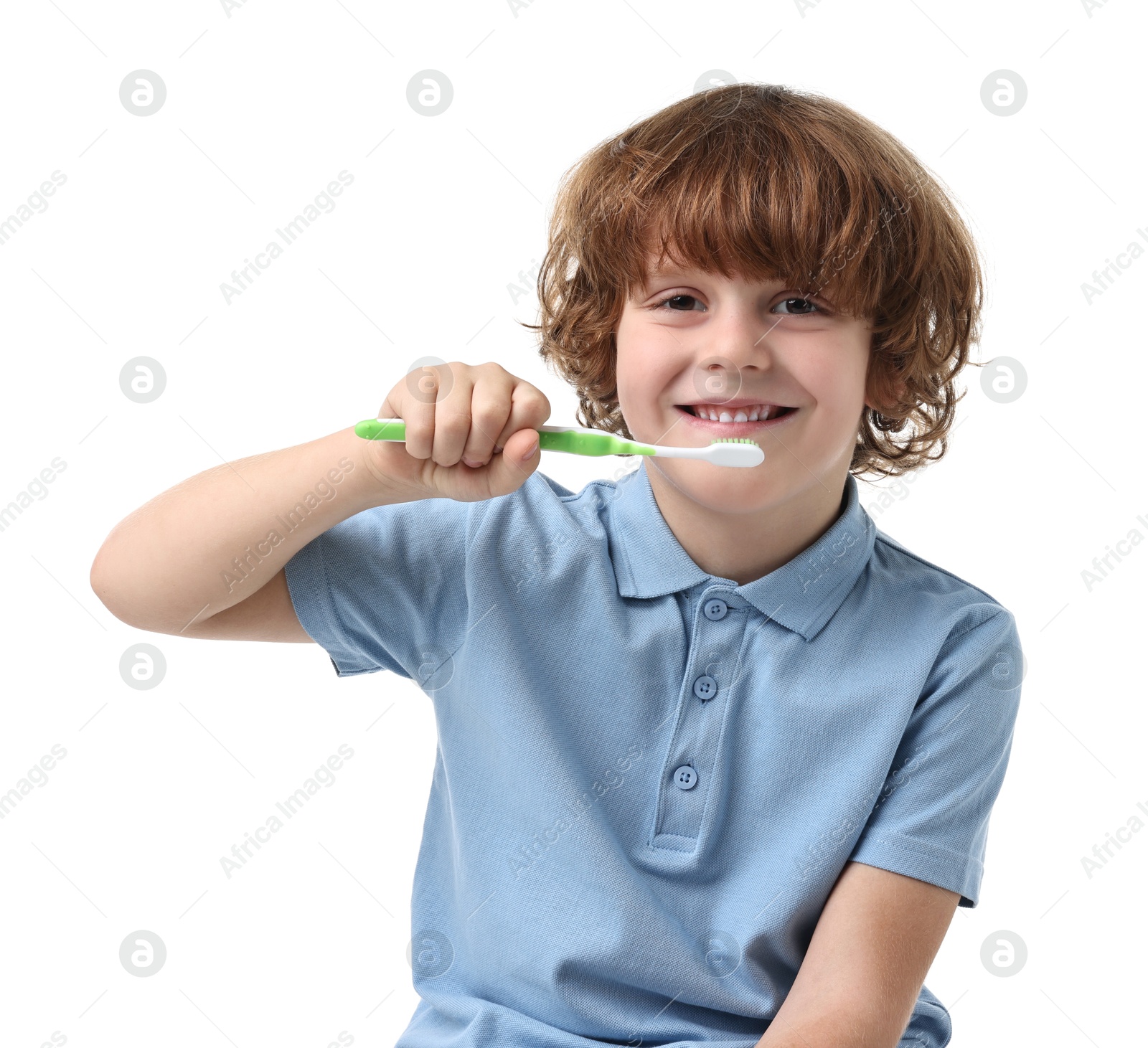 Photo of Cute boy brushing his teeth on white background