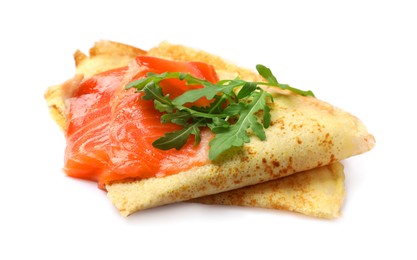 Photo of Delicious crepes with salmon and arugula isolated on white