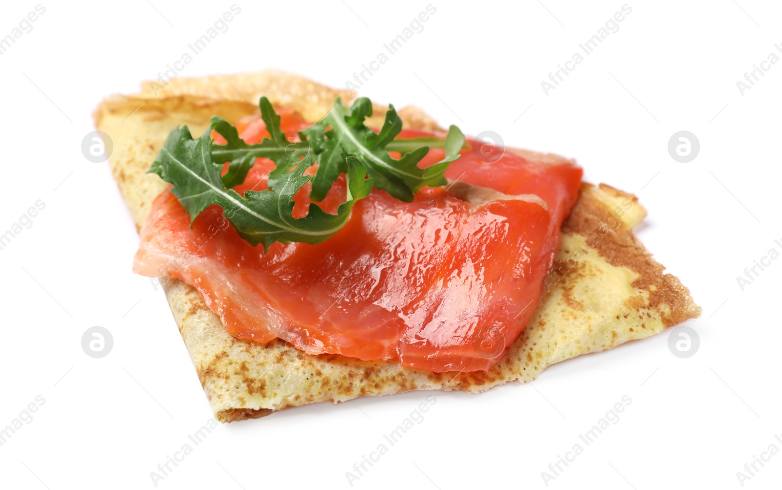 Photo of Delicious crepe with salmon and arugula isolated on white