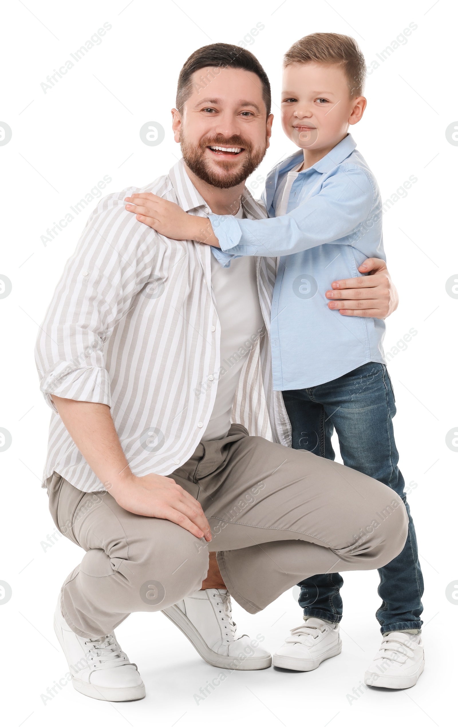 Photo of Happy father with his cute little son on white background