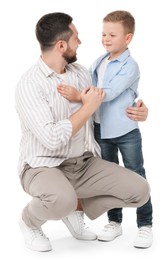 Photo of Happy father with his cute little son on white background