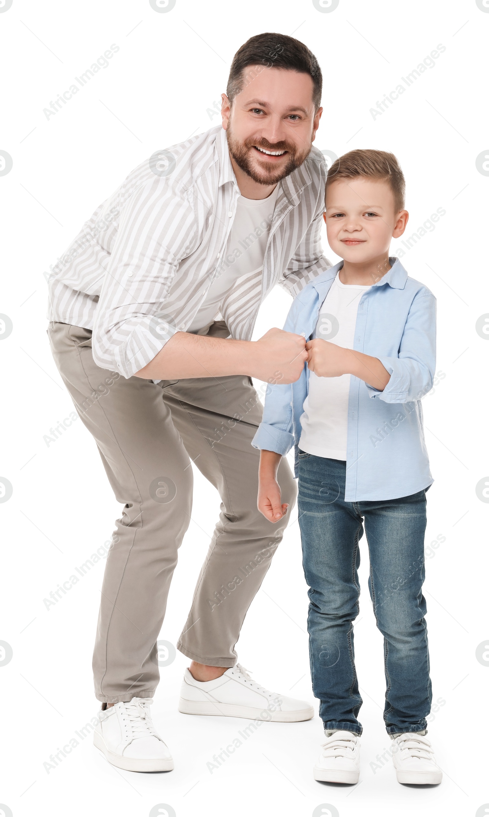 Photo of Happy father with his cute little son on white background