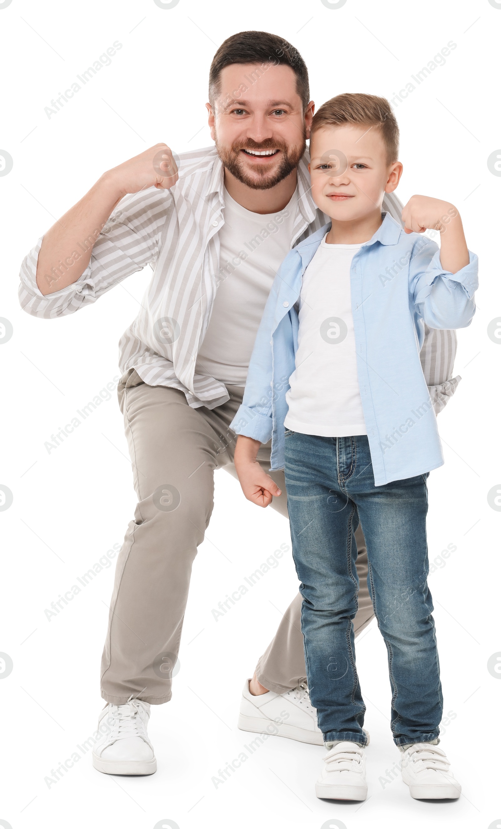 Photo of Happy father with his cute little son on white background